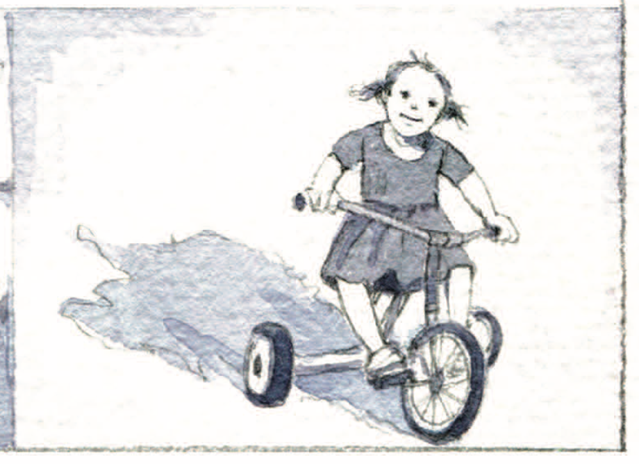 A little girl rides a tricycle. 